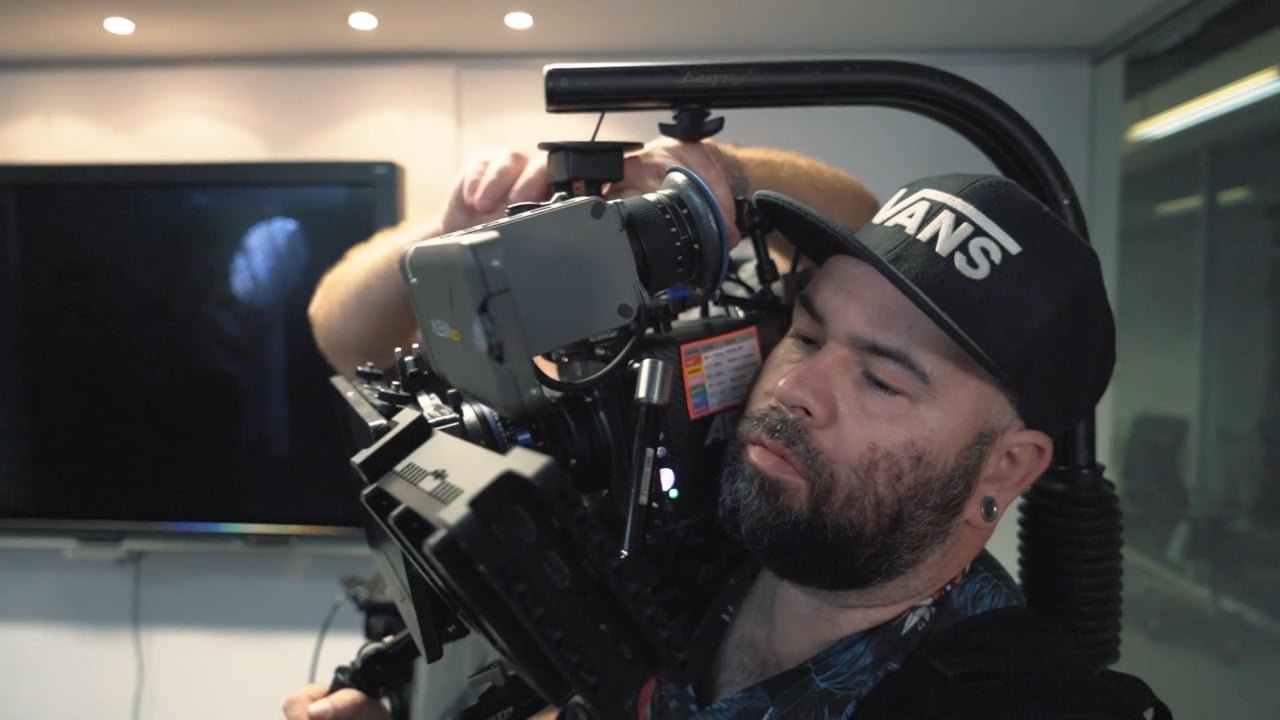 Dingo Lab cinematographer operating a professional camera